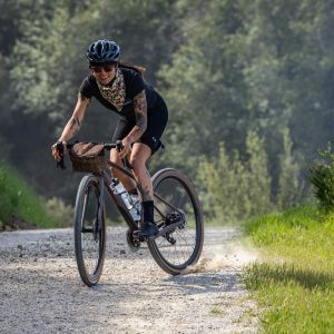 A woman skidding in gravel on the Devote Advanced