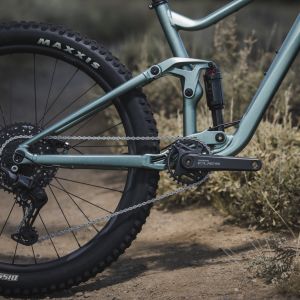 Closeup of rear wheel and suspension on mountain bike