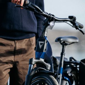 A close up view of the integrated light on the front end of a Giant NewTour E+ city bike.