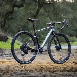 Quarter profile shot of gravel bike on dirt road