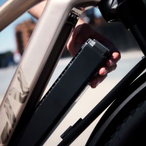 A cyclist removes the battery from the Liv Tempt E+ EX.