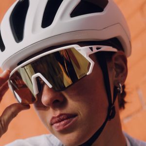 Girl wearing glasses and Liv Pursuit Mips helmet in white.