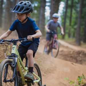 Kids riding youth mountain bikes on trails