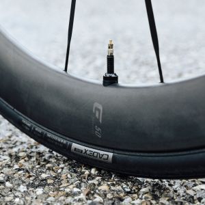 Close up look at the side of the CADEX Aero Tire mounted on a CADEX road bike wheel.
