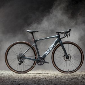 Giant Defy Advanced E+ Elite AR on a foggy dirt road.