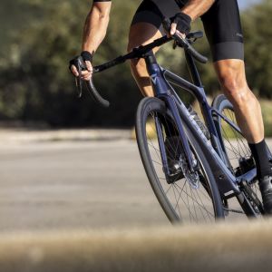 Close up view of cyclist riding Giant Defy E+ Elite.