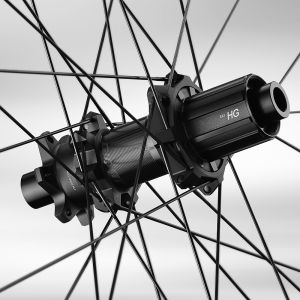 A close up look at the Giant TRA HD MTB wheel hub with stylized background.