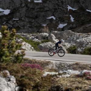 A youth road biker on a Giant seek rides a mountain pass on Giant SLR 40 1 650b wheels.