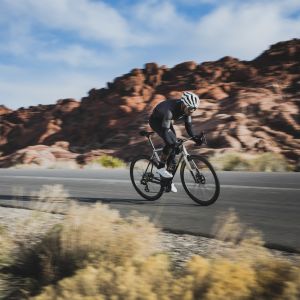 Cyclist sprinting on CADEX Max 40 wheels.