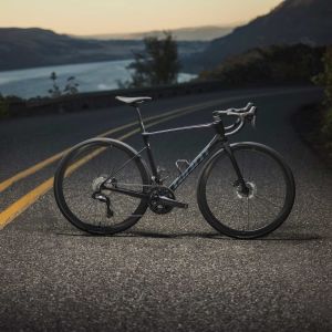 Road bicycle balancing on the road in great lighting