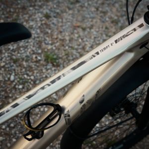 A close up view of the top tube design on a Liv Tempt E+ EX mountain bike.
