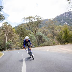 Triathlete sprinting in a corner