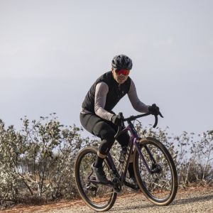 Gravel biker wearing Giant Rev Elite helmet.