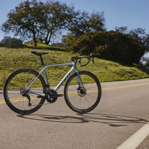 Angled profile view of Giant TCR Advanced on a mountain road.
