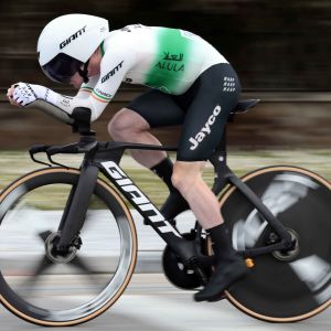 A Jayco Alula pro cyclist rides a Giant Trinity Advanced on hte opem roads with a Giant Rivet Mips helmet.