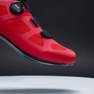 A close up side view of the ventilation on the side of the red Giant Surge 2 road shoes.