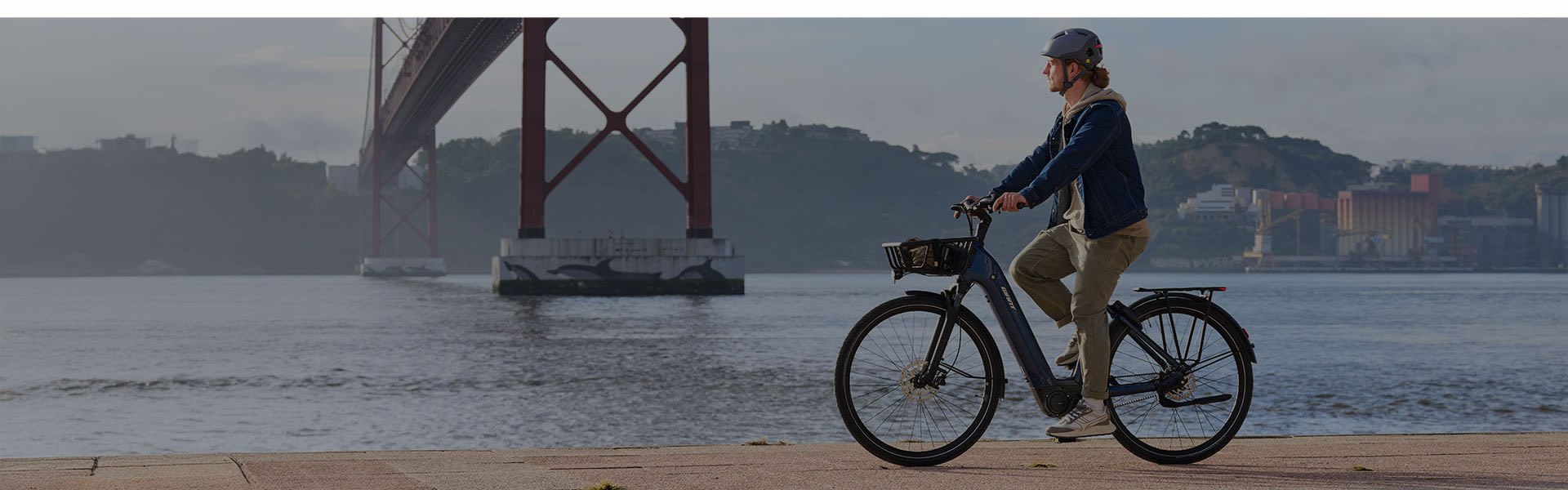 city e-biker leaning against awall