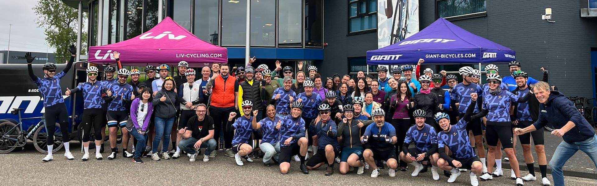 group of cyclists posing for photo