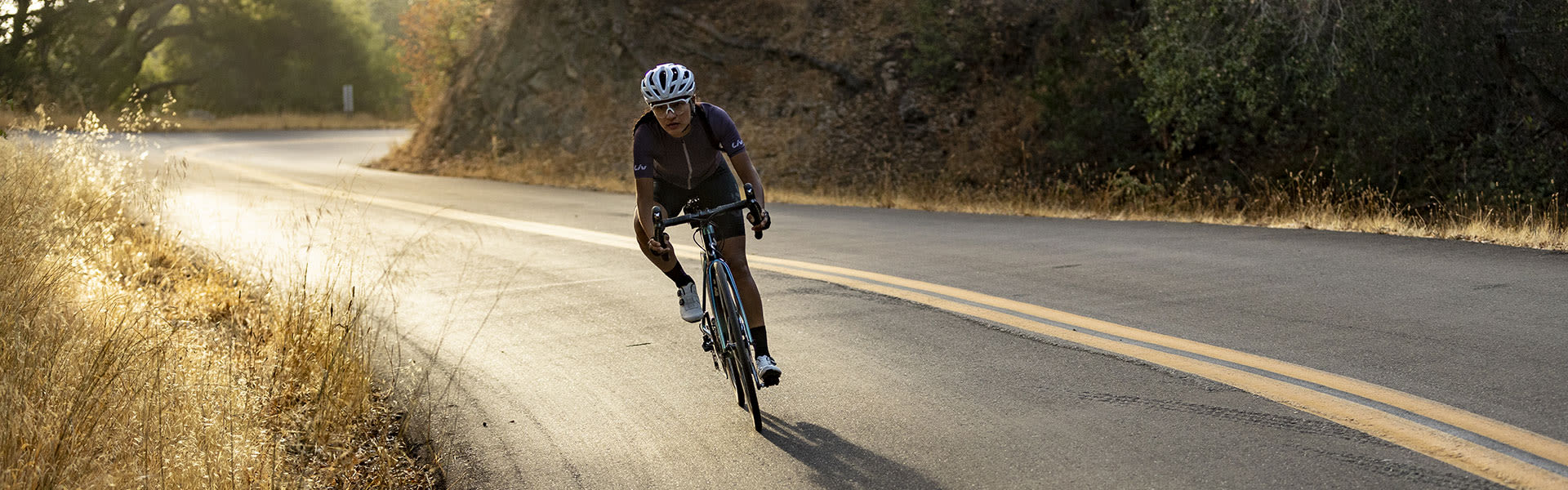 Liv riders cycling up hill