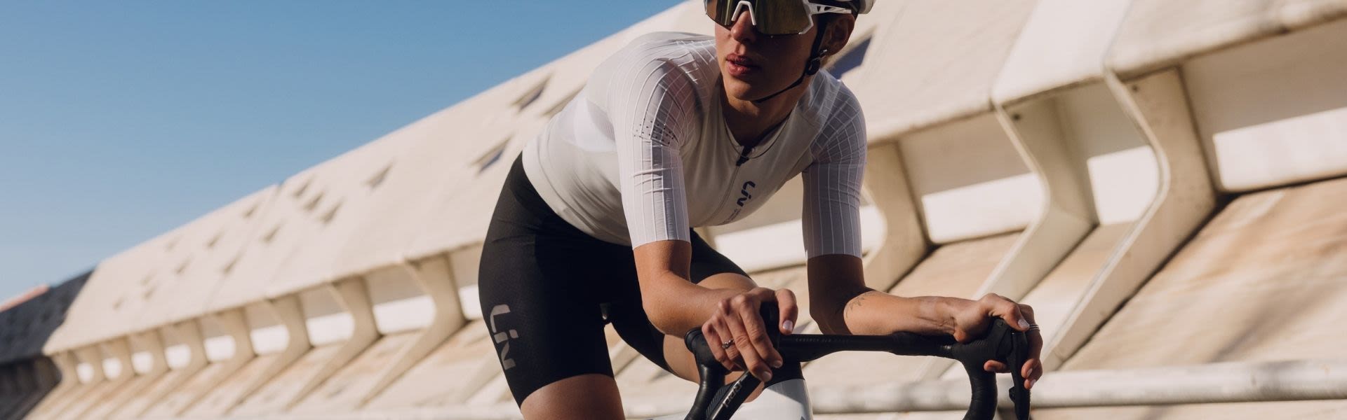 image of a woman riding a enviliv advanced SL 0 bike