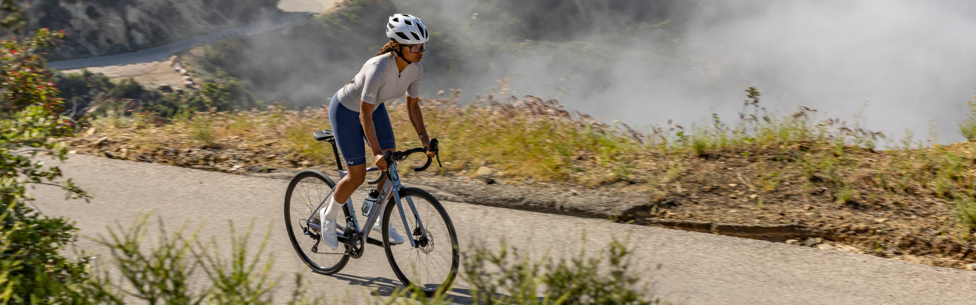 A woman riding on a road race bike