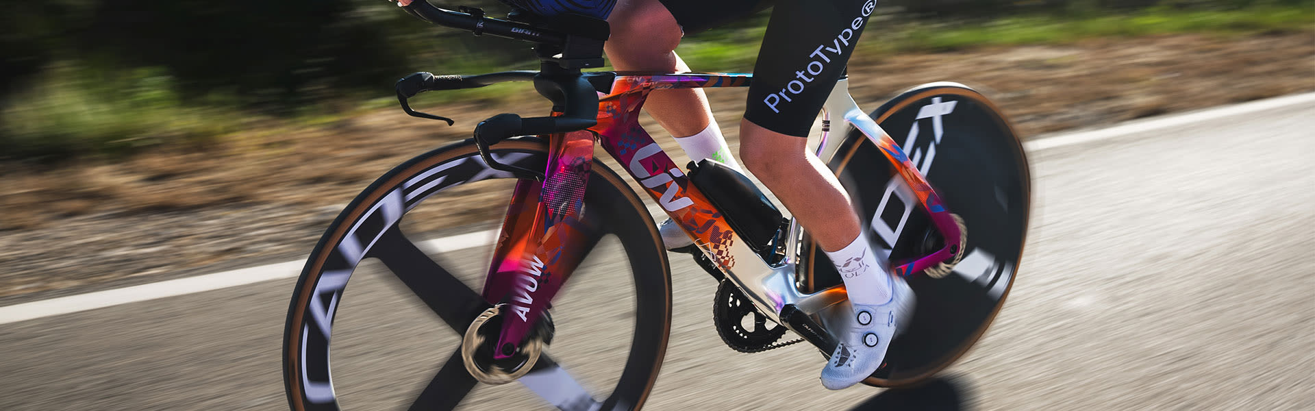 a woman riding a triathlon bike