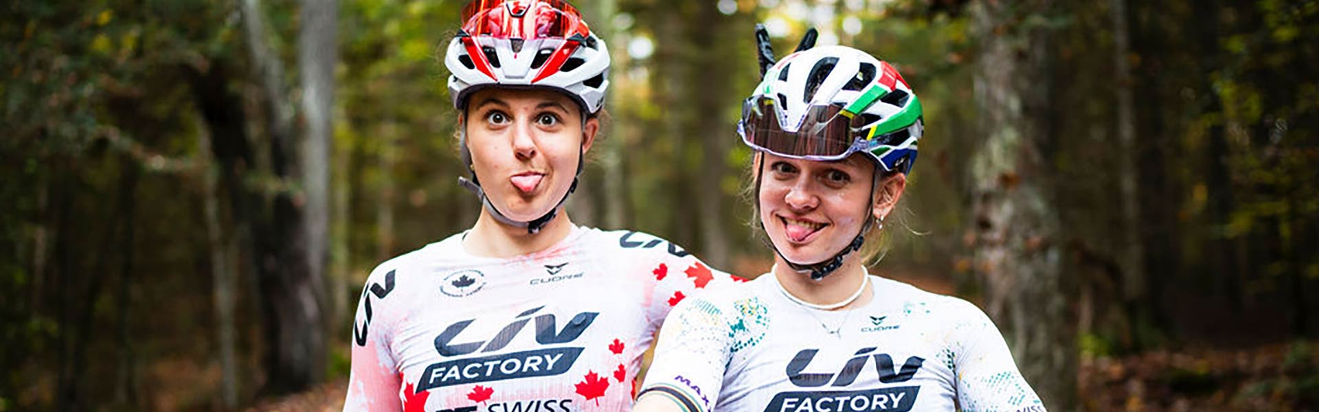 two women cyclists goofing around