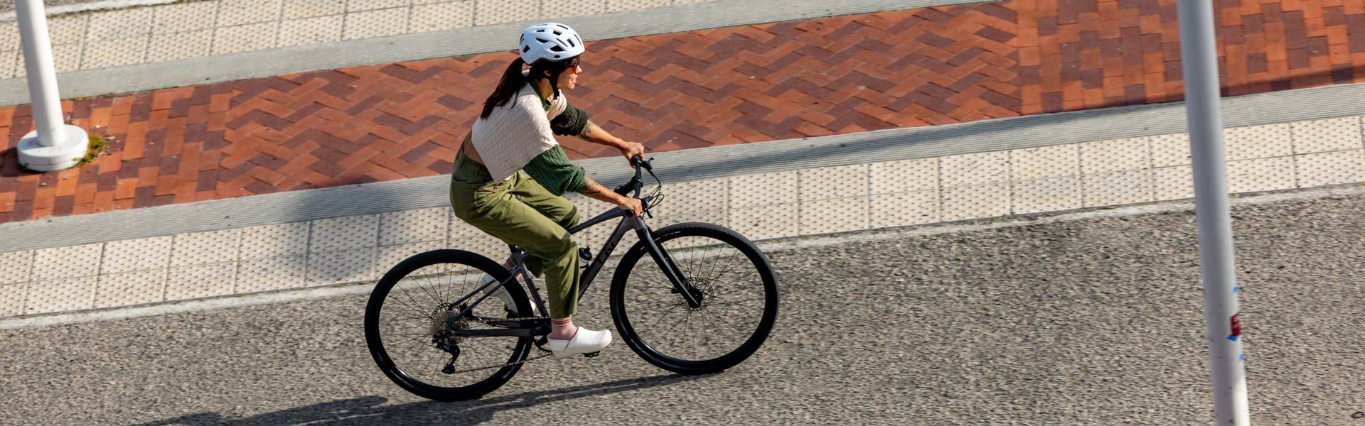 a woman riding a commuter bike