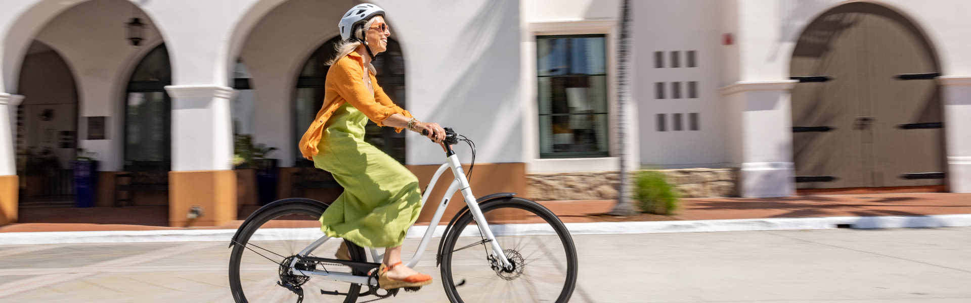 a woman riding a cruiser bike