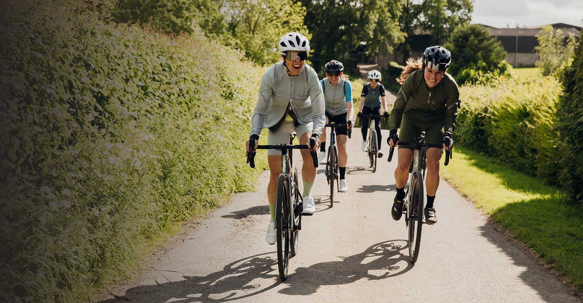 Women having fun cycling together