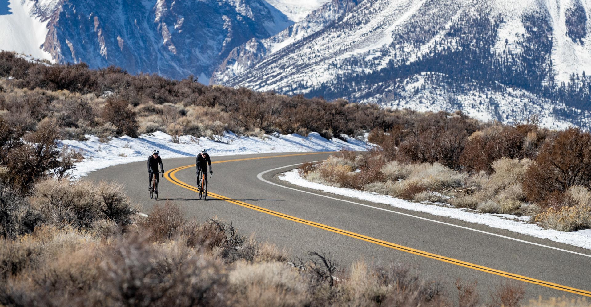 Cyclists on road bikes riding in winter