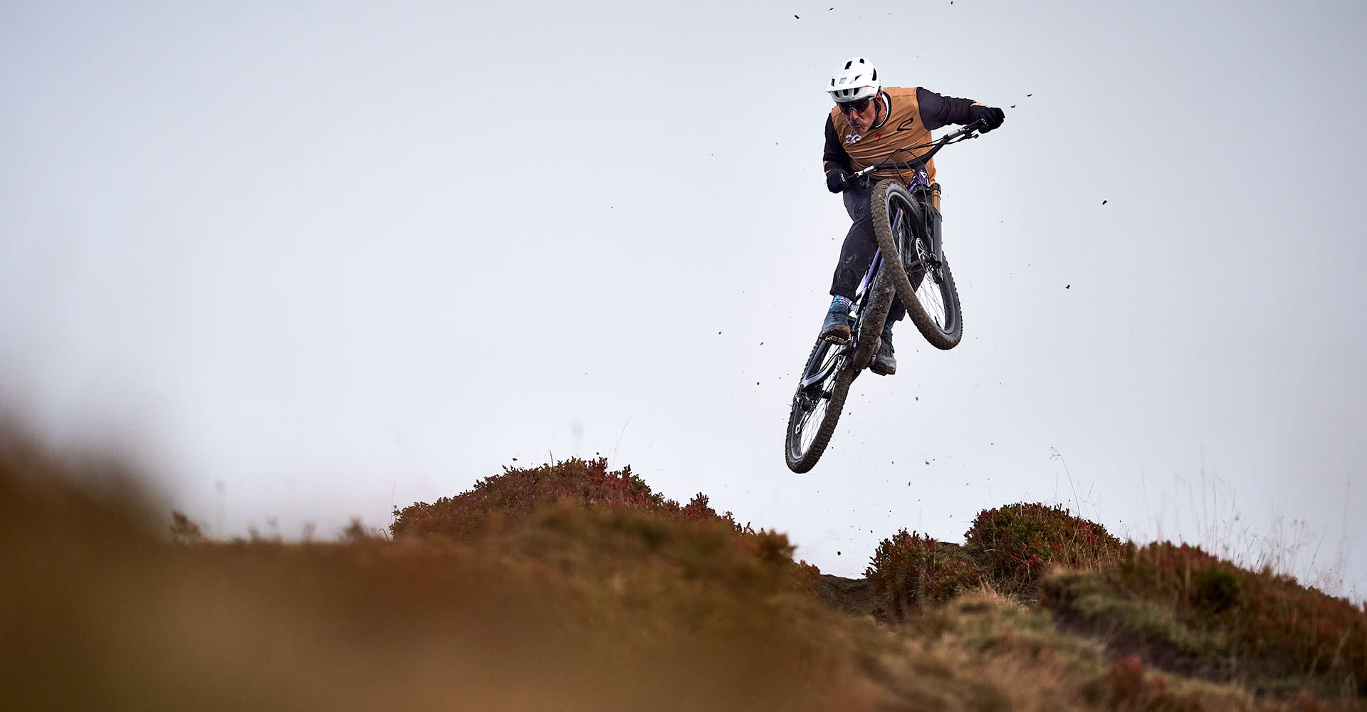 mountain biker in the air on an enduro ebike