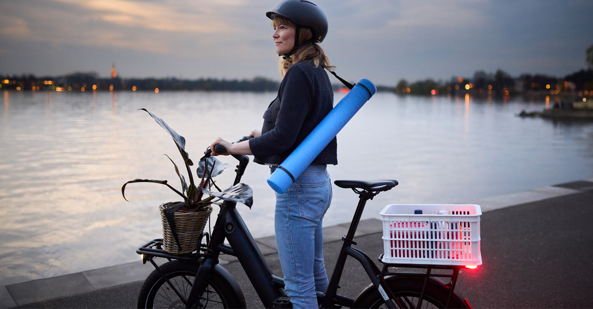 woman standing over electric bike