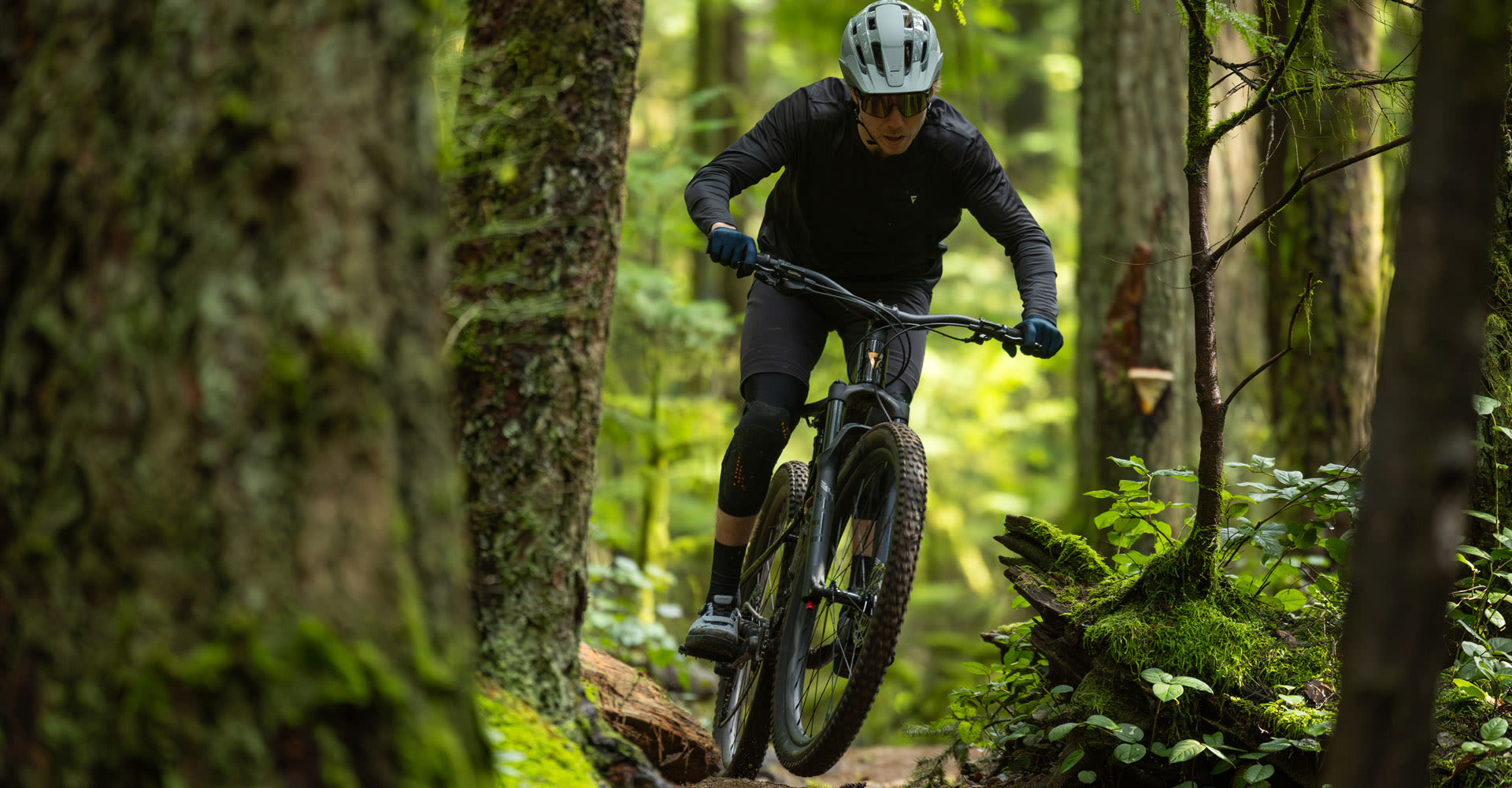 Mountain biker riding stance in the mountains.