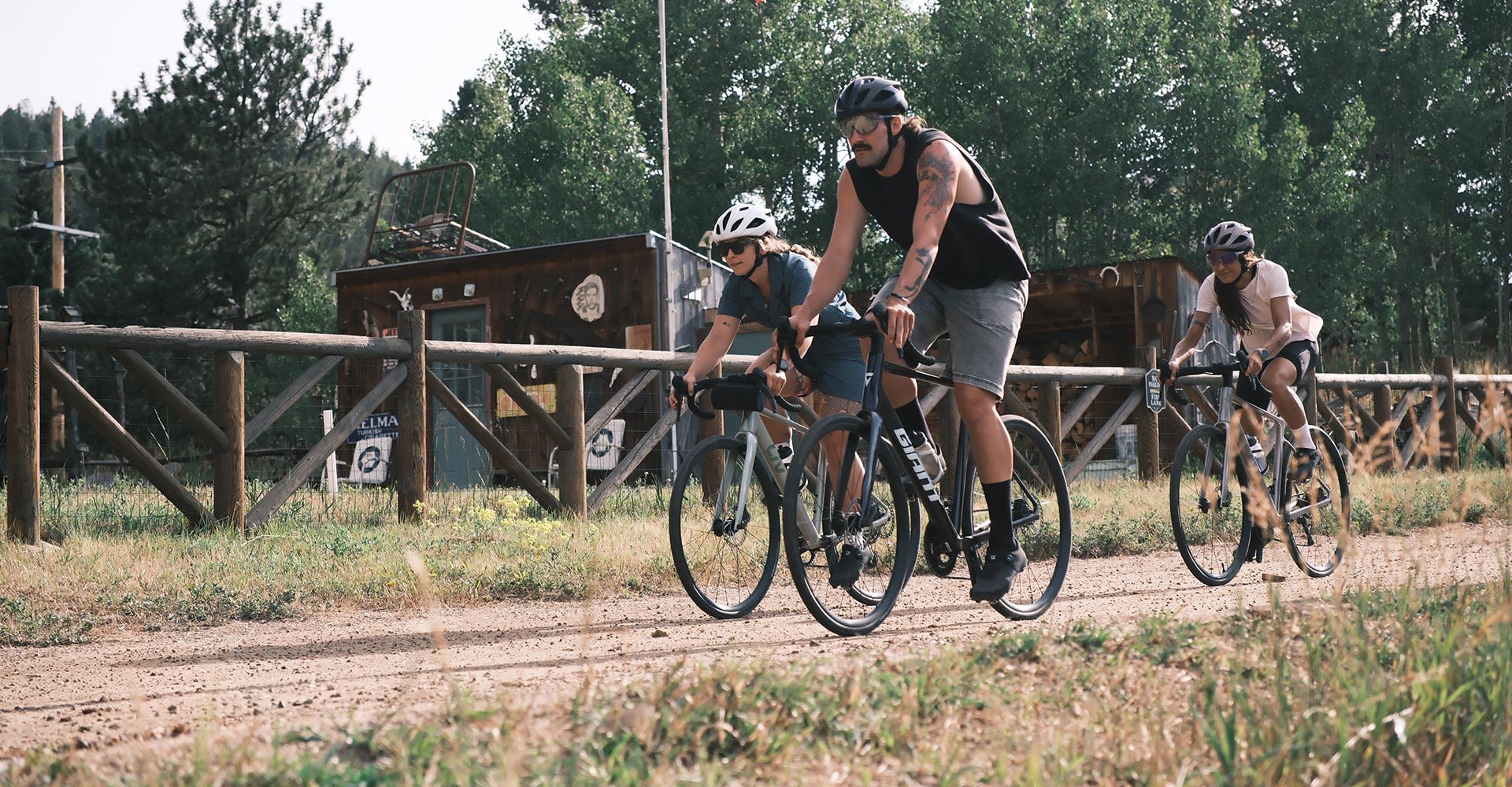 Cyclists on road bikes on dirt road
