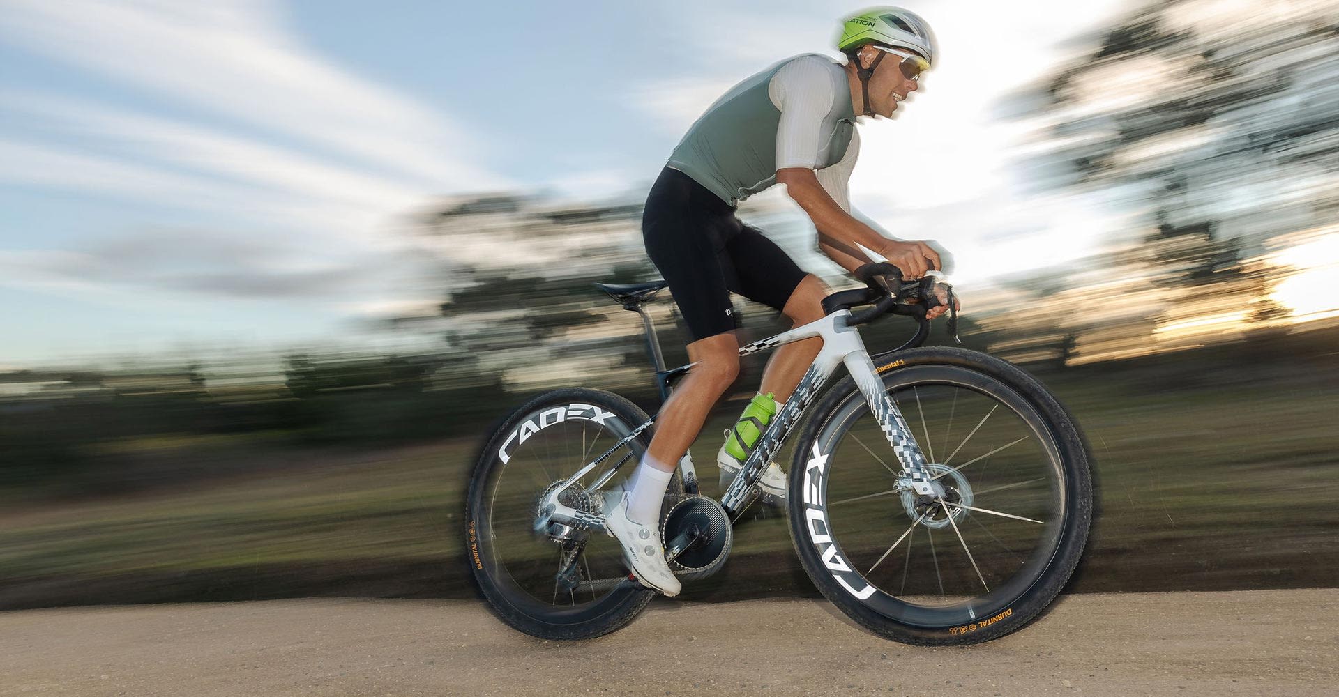 gravel biker sprinting out of saddle