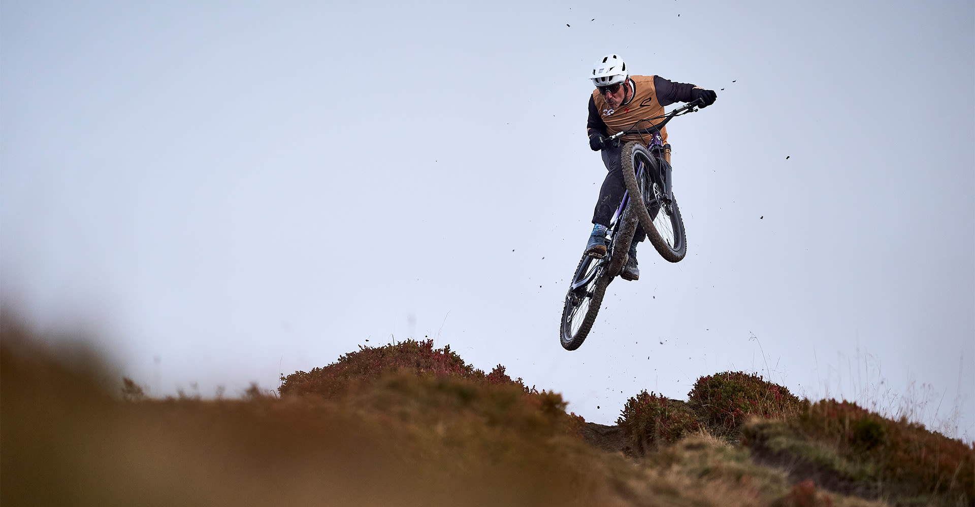 Electric biker jumping on mountain bike