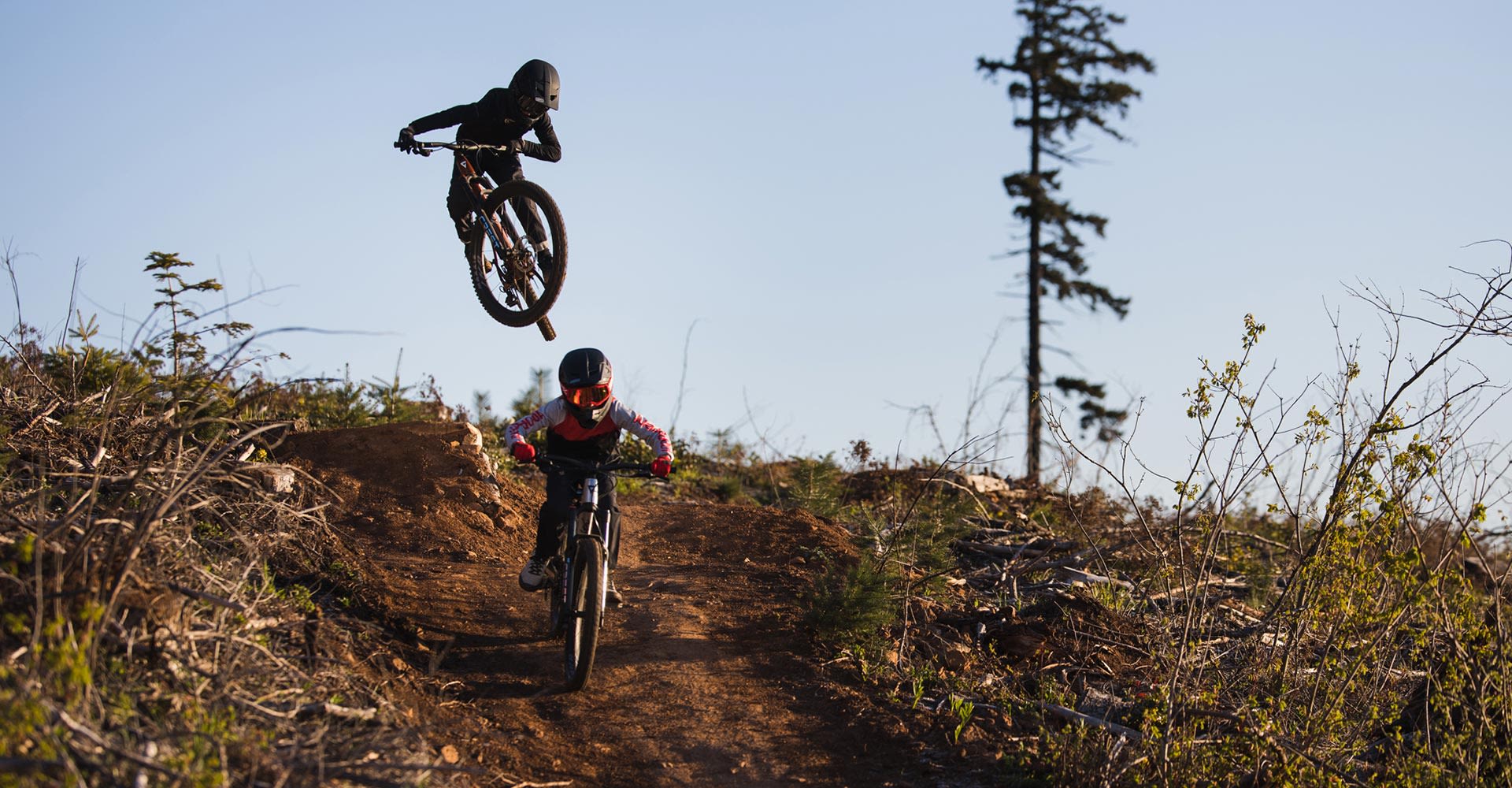 two kids on youth full suspension bikes