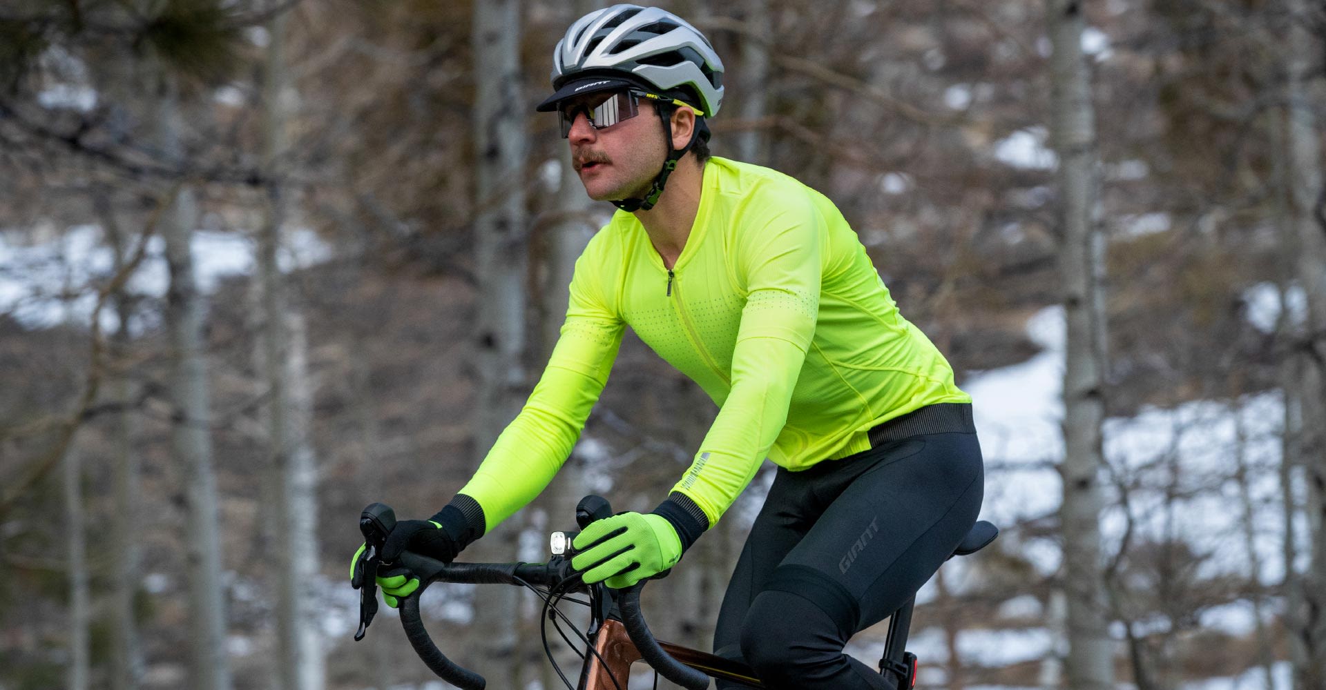 cyclist with neon bright long sleeve jersey