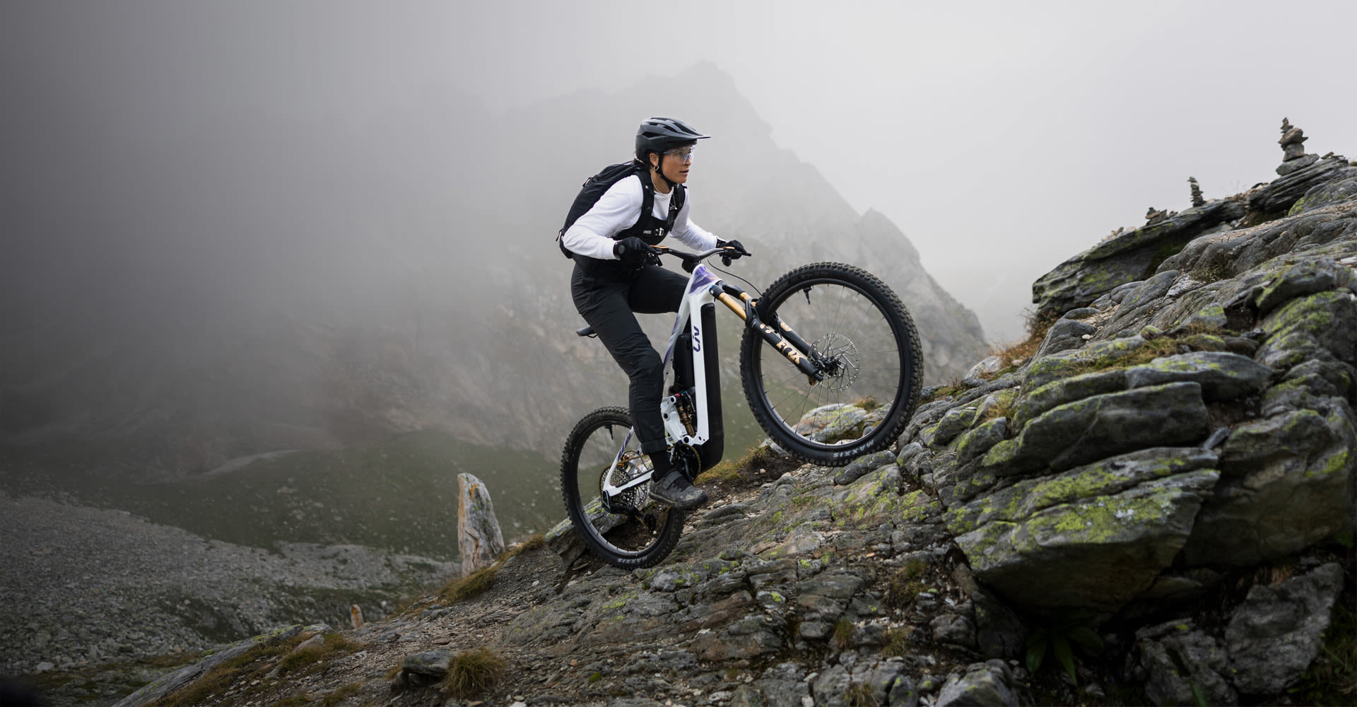 Mountain biker riding up a steep hill. 