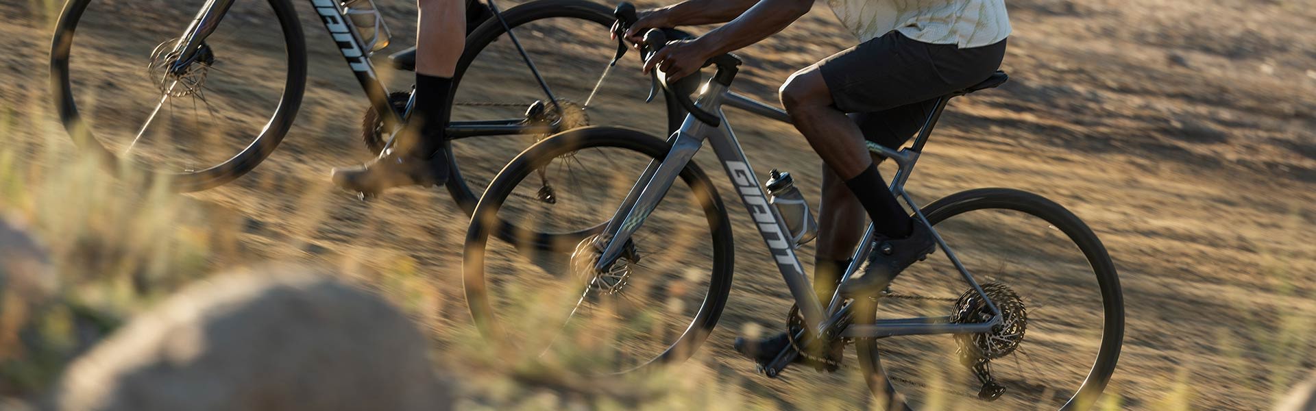 road cyclists on dirt road