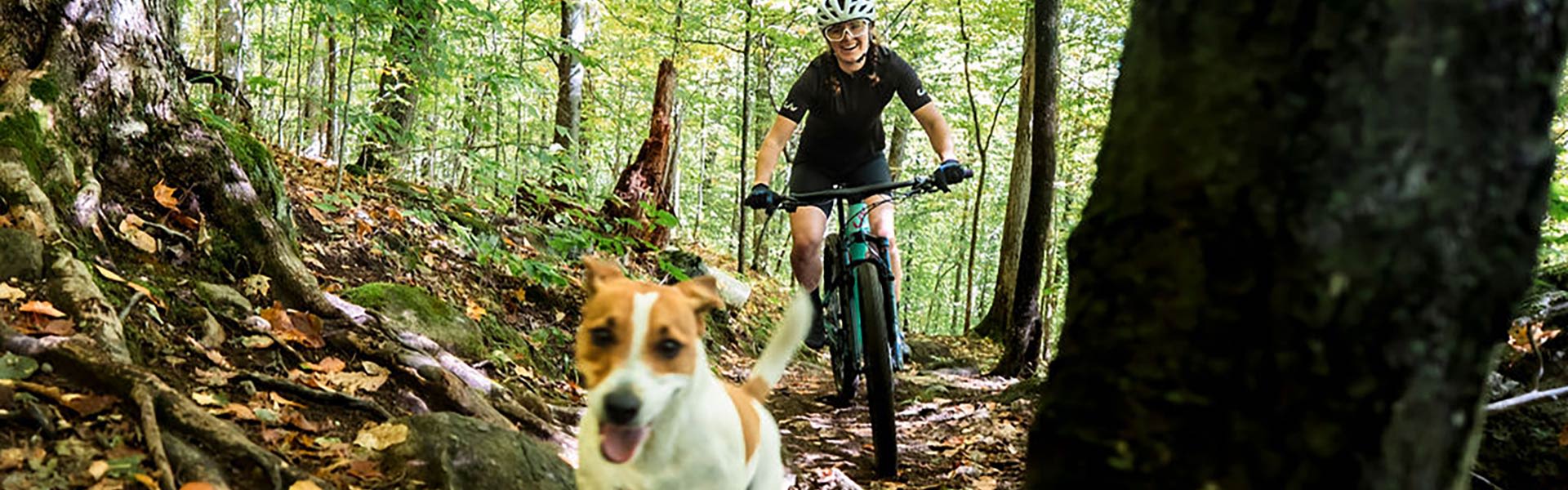 woman riding with a puppy