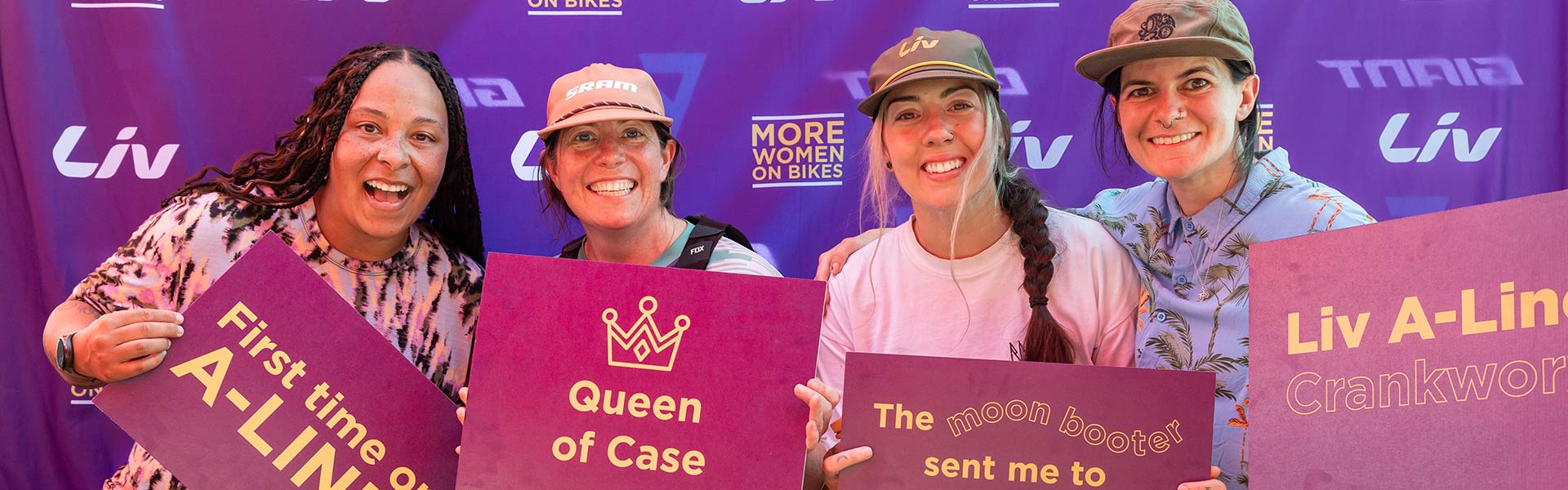 women holding up signs