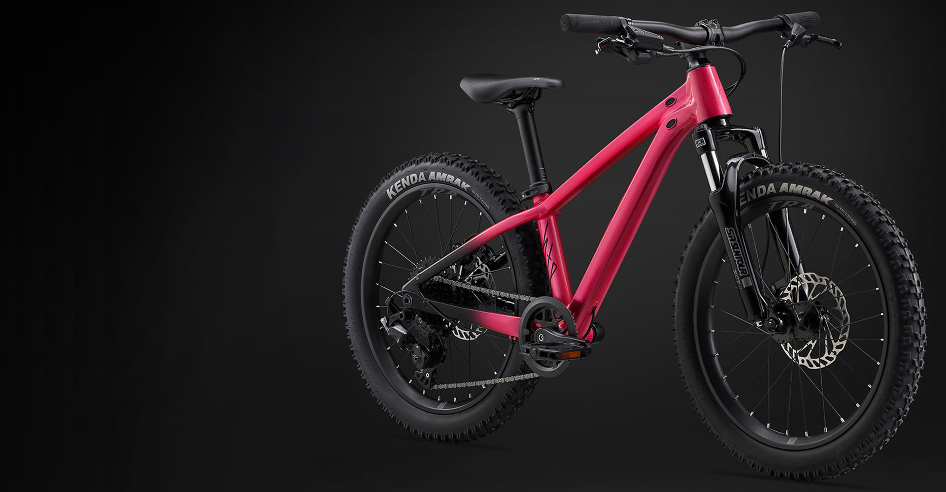 pink dirt jumper on black background