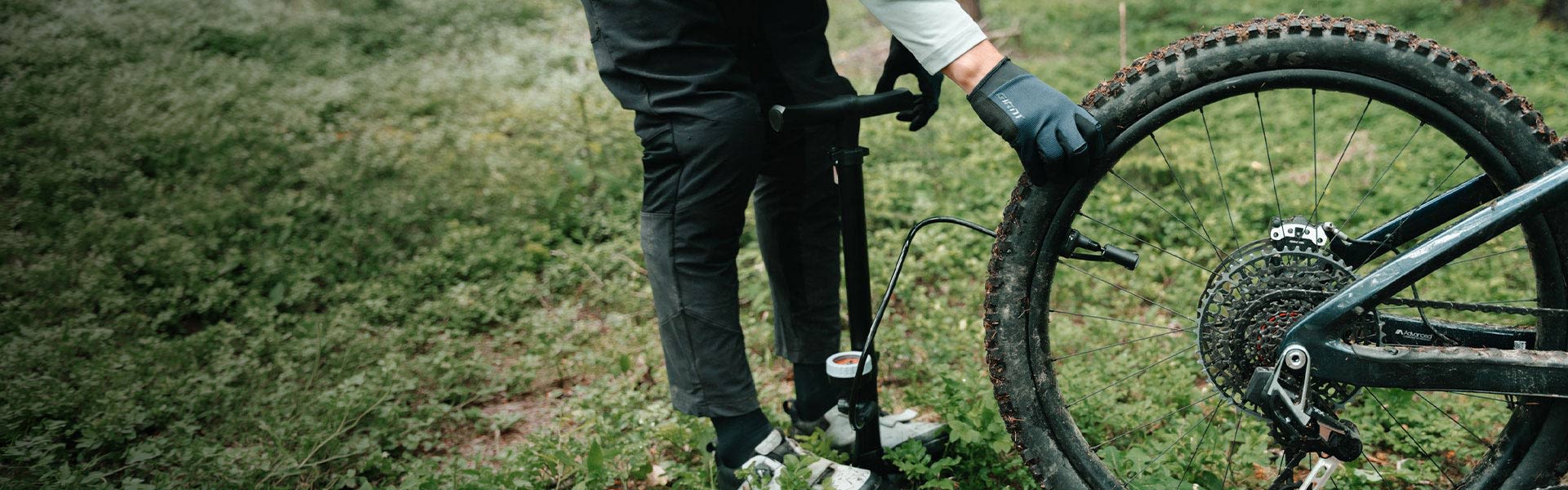 Person checking tire pressure
