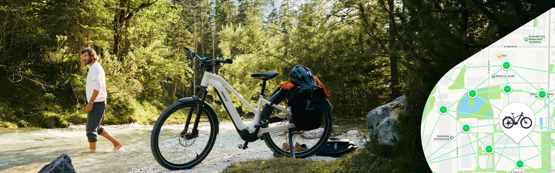 An e-bike parked near a river with a man walking into the river.