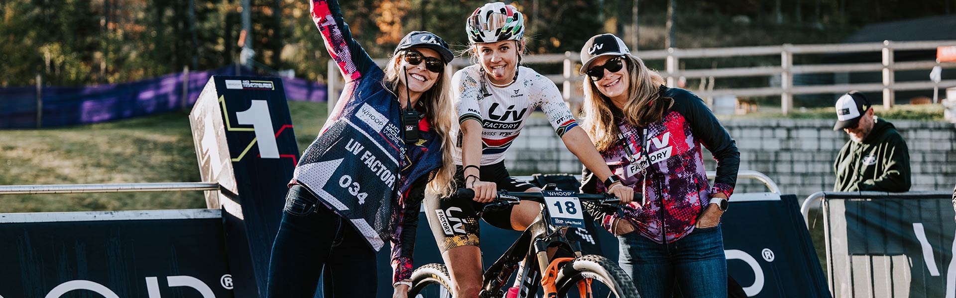 mountain bike racer on trainer surrounded by fans
