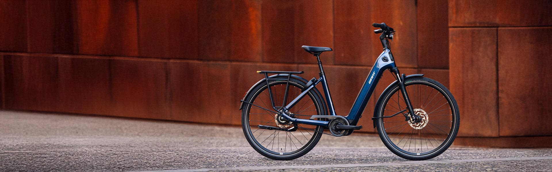 Newtour E+ electric bike on conrete road
