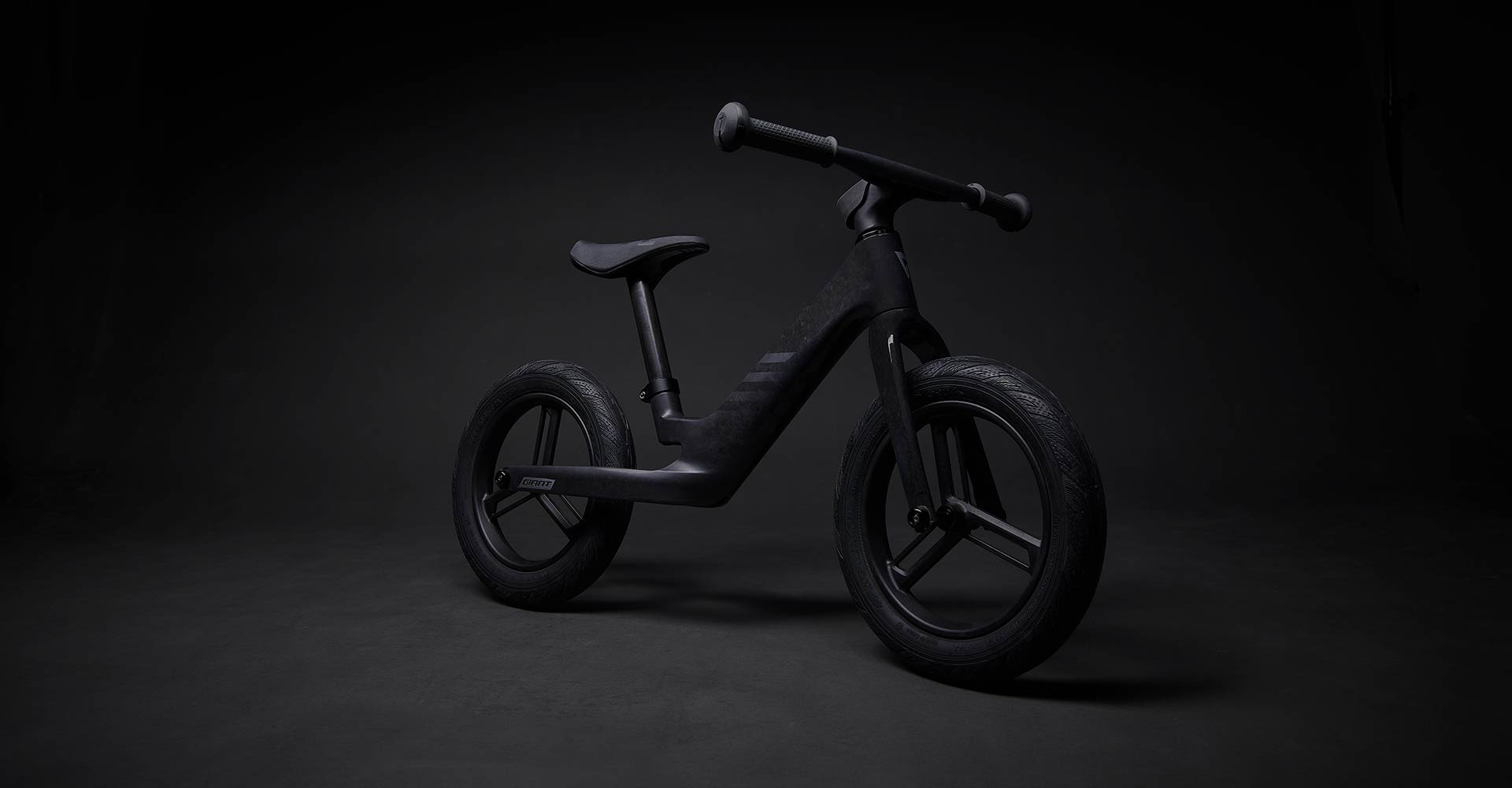 pre rcarbon push bike on black background