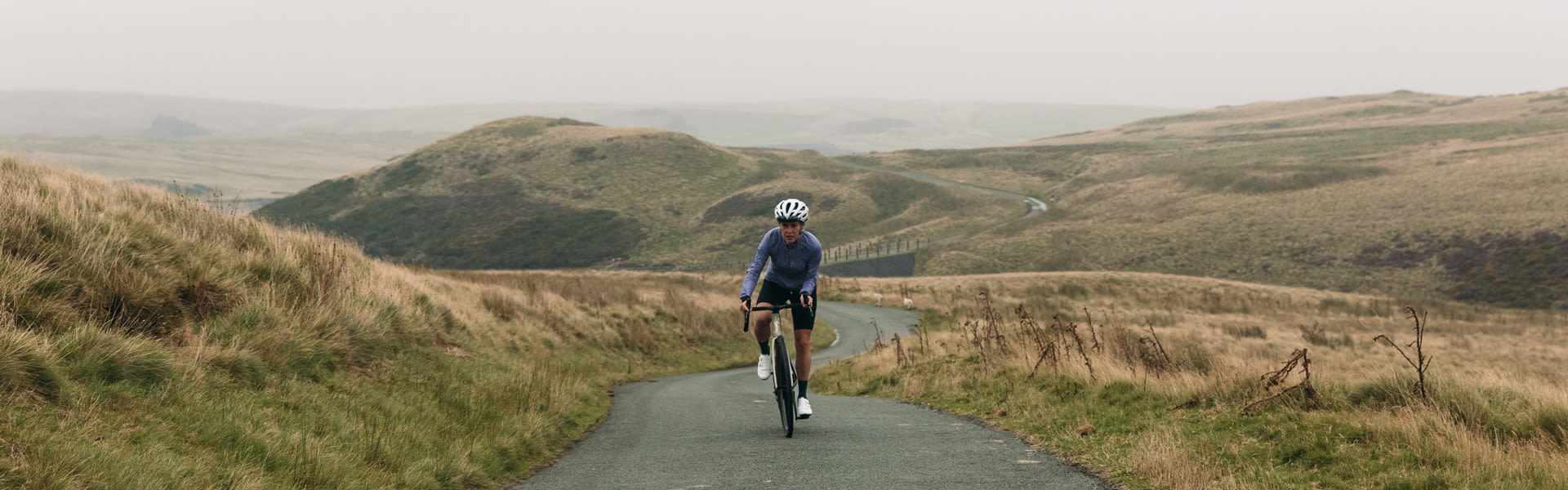 Road cyclist climbing on an endurance road bikes